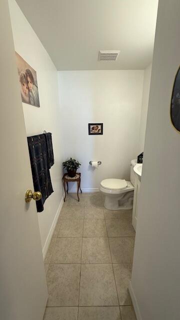 bathroom with tile patterned floors and toilet