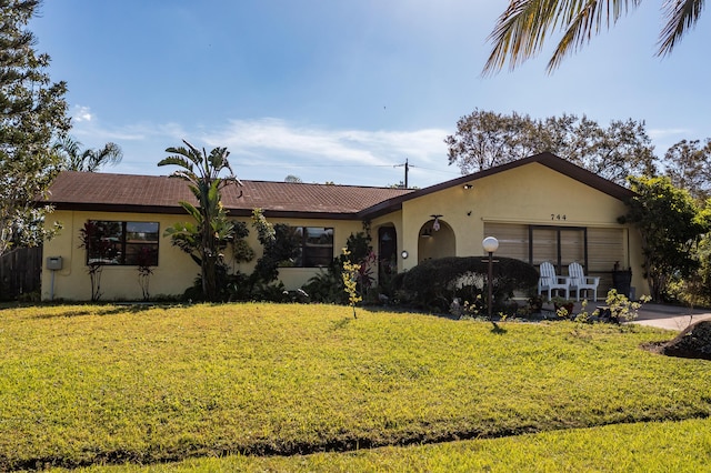 ranch-style house with a front lawn