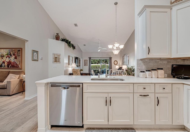 kitchen featuring pendant lighting, dishwasher, sink, ceiling fan, and white cabinetry