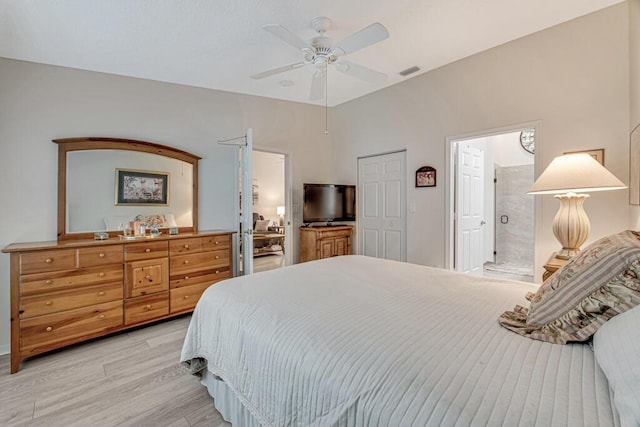 bedroom featuring ensuite bathroom, ceiling fan, and light hardwood / wood-style floors