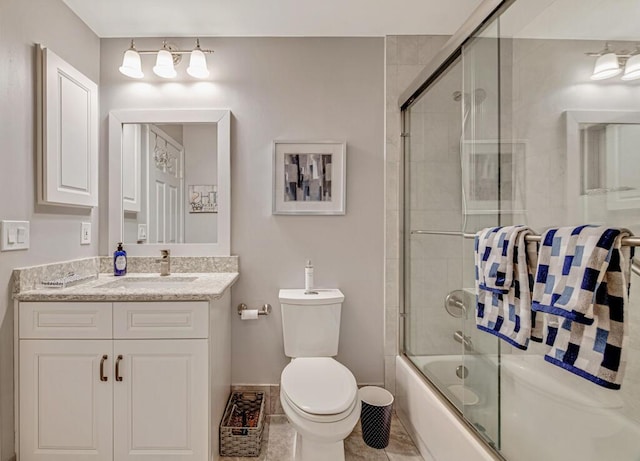 full bathroom with tile patterned flooring, vanity, toilet, and enclosed tub / shower combo