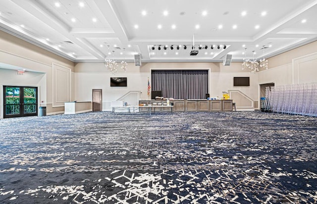 interior space featuring beamed ceiling, ornamental molding, carpet floors, and coffered ceiling