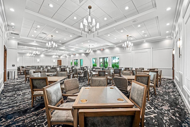 dining area featuring coffered ceiling and ornamental molding