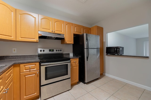 kitchen with light tile patterned floors, light brown cabinetry, and appliances with stainless steel finishes