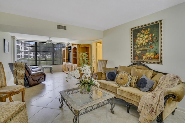 living room with ceiling fan and light tile patterned floors