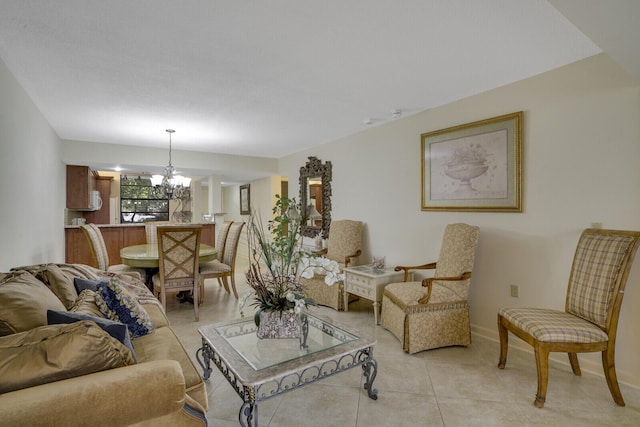 tiled living room featuring a chandelier