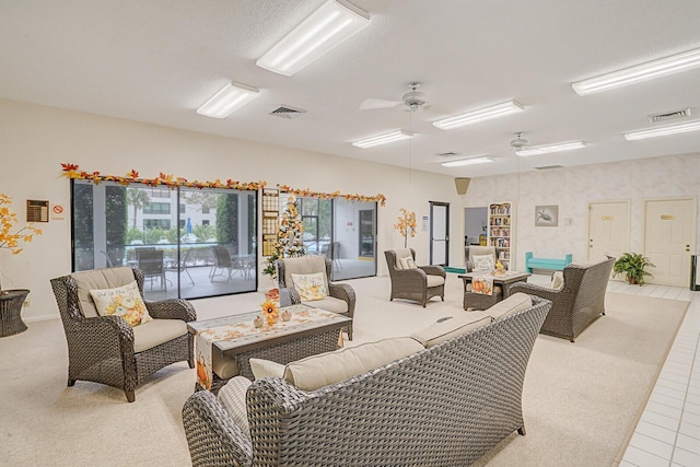 tiled living room featuring ceiling fan