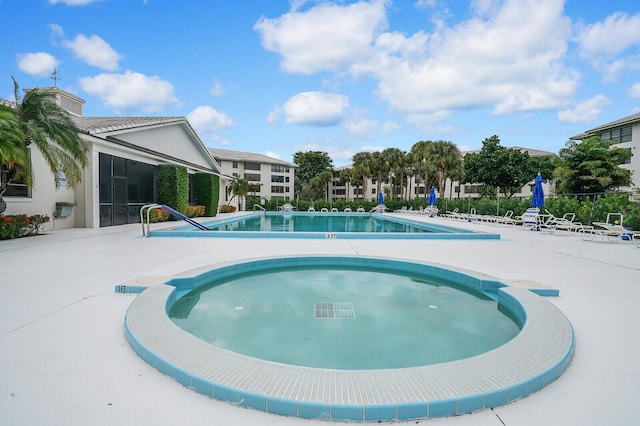 view of pool featuring a patio