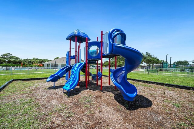 view of playground featuring a yard