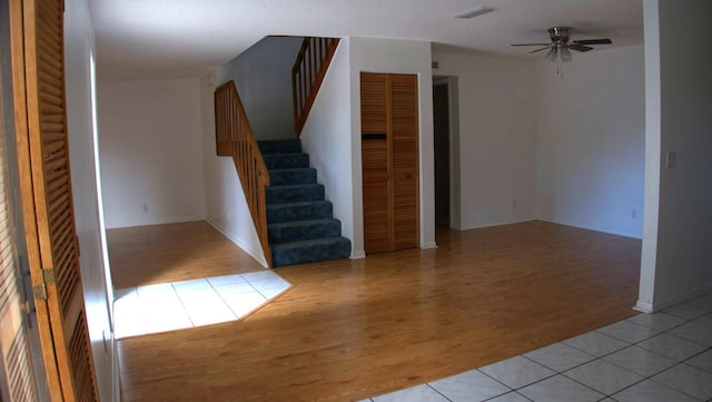 spare room featuring ceiling fan and light hardwood / wood-style floors