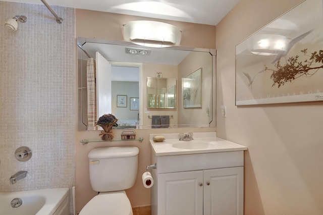 full bathroom featuring vanity, toilet, and tiled shower / bath