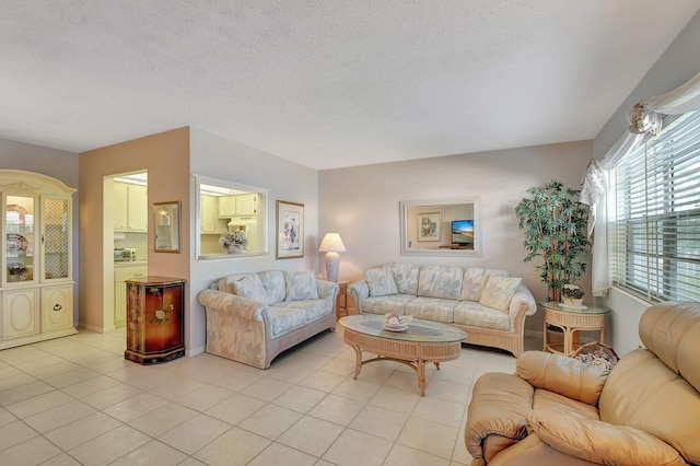 tiled living room with a textured ceiling