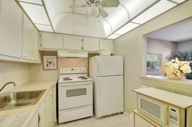 kitchen featuring ceiling fan, sink, light tile patterned floors, and white appliances