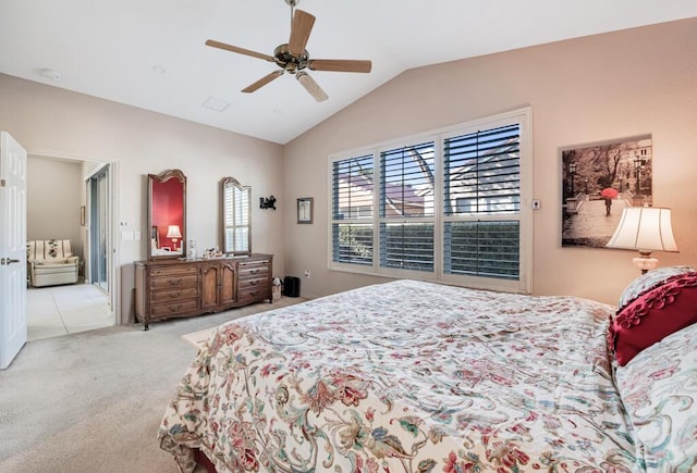 carpeted bedroom with ceiling fan and lofted ceiling