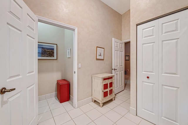 hallway featuring light tile patterned floors