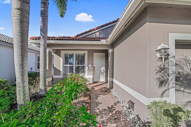 doorway to property with a garage