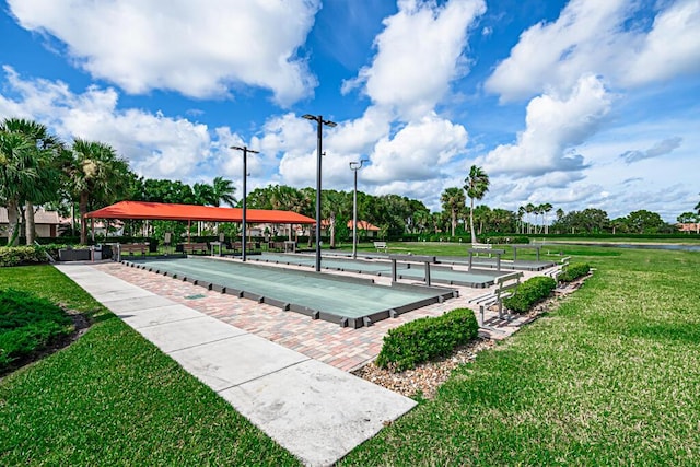 view of property's community featuring a yard