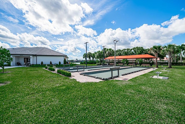 view of home's community featuring a yard