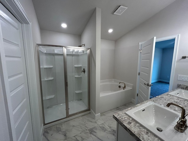 bathroom featuring shower with separate bathtub and vanity