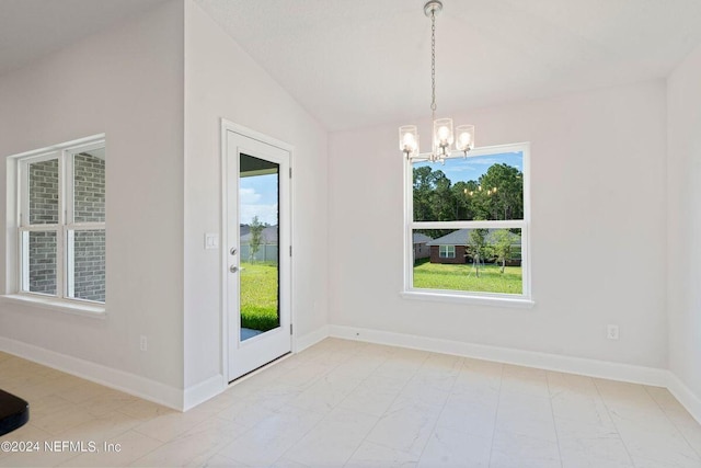 unfurnished dining area featuring vaulted ceiling and a notable chandelier