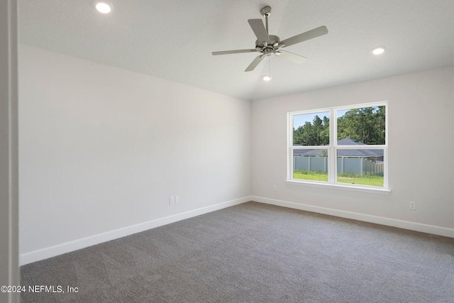 carpeted empty room with ceiling fan