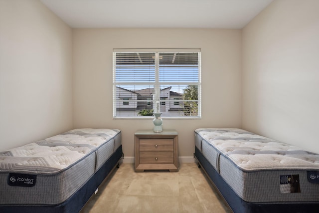 bedroom featuring light carpet