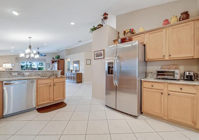 kitchen with appliances with stainless steel finishes, light tile patterned floors, ceiling fan, and light brown cabinetry