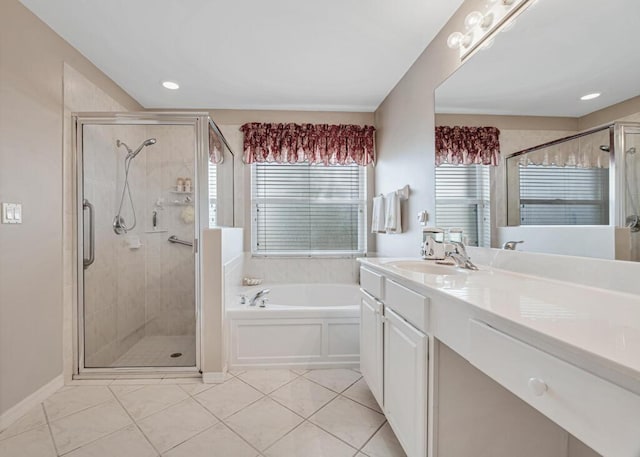 bathroom with tile patterned floors, vanity, and independent shower and bath