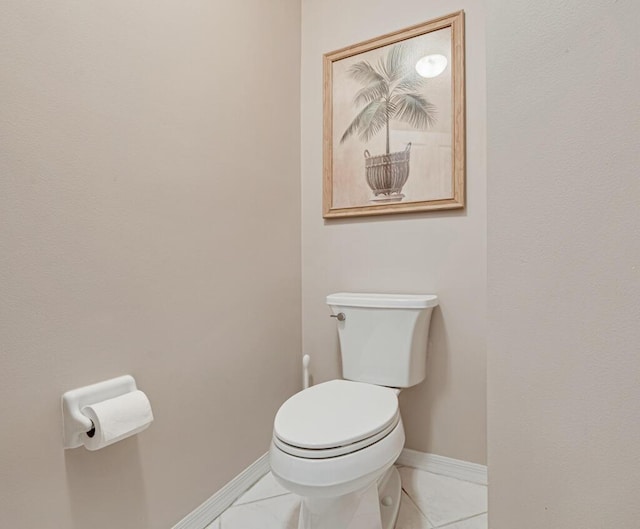 bathroom featuring tile patterned flooring and toilet