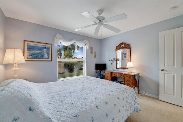 bedroom with light carpet and ceiling fan