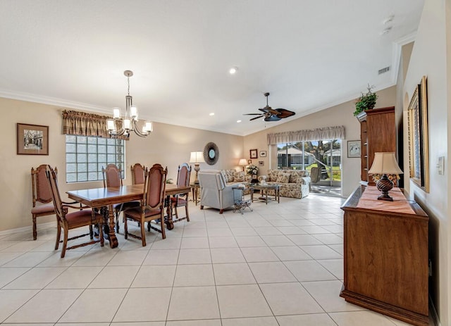 dining area featuring lofted ceiling, ceiling fan with notable chandelier, ornamental molding, and light tile patterned flooring