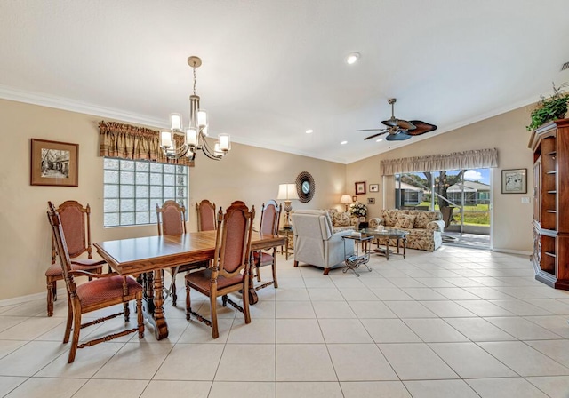 dining area with light tile patterned floors, ceiling fan with notable chandelier, crown molding, and lofted ceiling