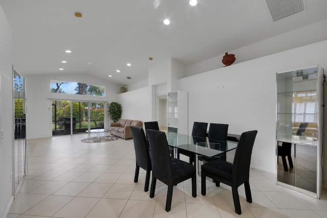 tiled dining area featuring french doors and high vaulted ceiling