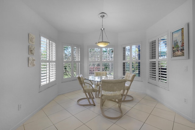 dining area featuring light tile patterned floors