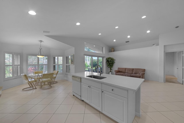 kitchen with white cabinets, lofted ceiling, sink, white dishwasher, and a center island with sink