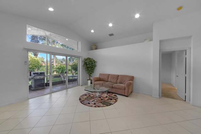 tiled living room featuring lofted ceiling