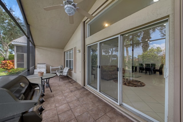 balcony with ceiling fan, a patio area, and a grill