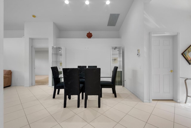 dining space featuring light tile patterned floors