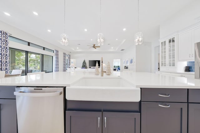 kitchen featuring white cabinets, stainless steel dishwasher, ceiling fan, and gray cabinetry