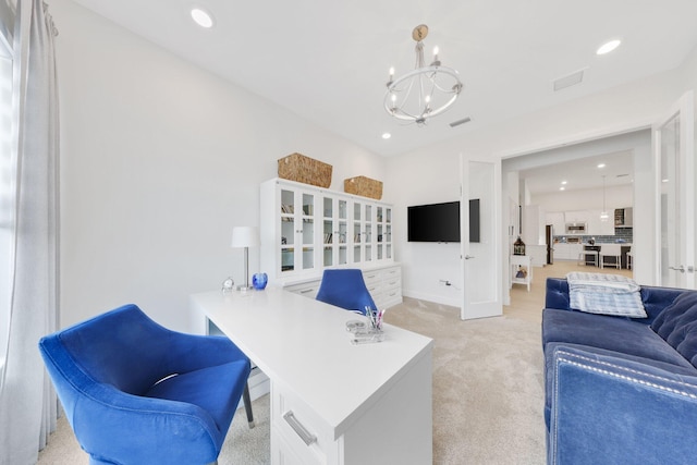 office area with light carpet and a chandelier