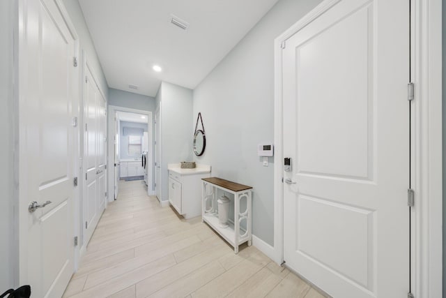 corridor featuring light hardwood / wood-style flooring