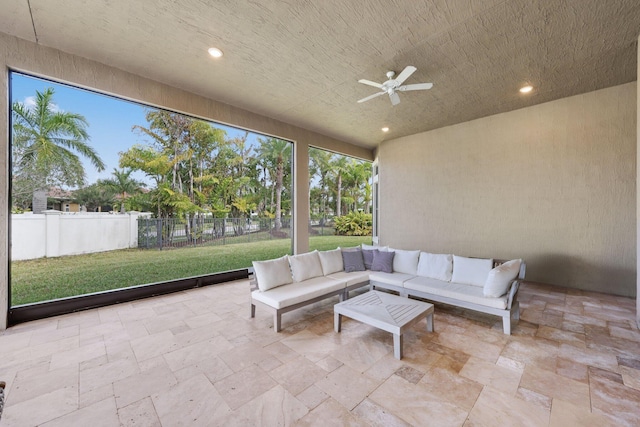 sunroom / solarium with ceiling fan