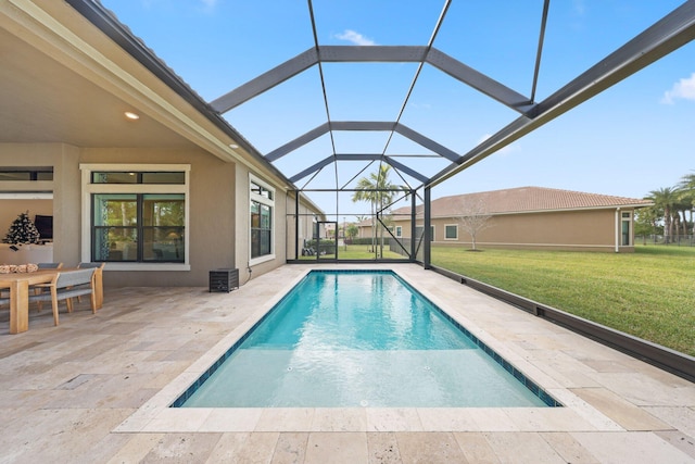 view of pool featuring a lawn, a patio area, and a lanai