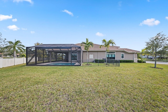 exterior space featuring a fenced in pool, glass enclosure, and a lawn