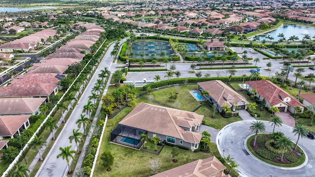 birds eye view of property with a water view