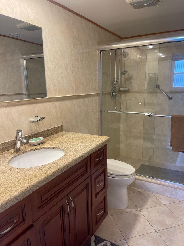 bathroom with vanity, backsplash, tile patterned floors, toilet, and an enclosed shower