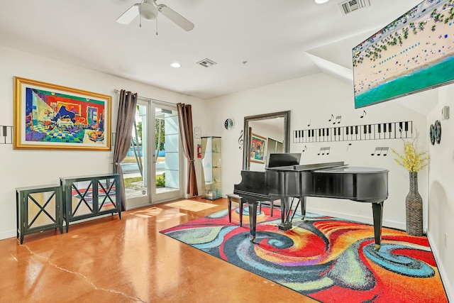 misc room with ceiling fan, concrete flooring, french doors, and vaulted ceiling