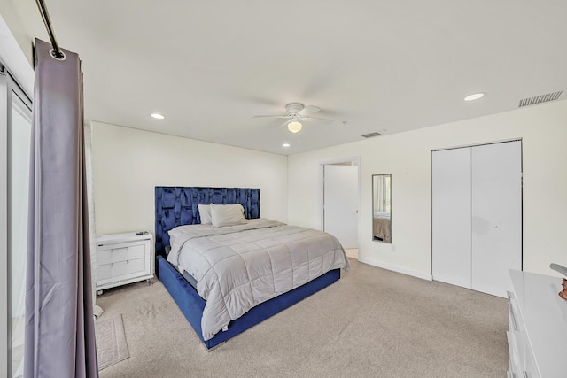 bedroom with light carpet and ceiling fan