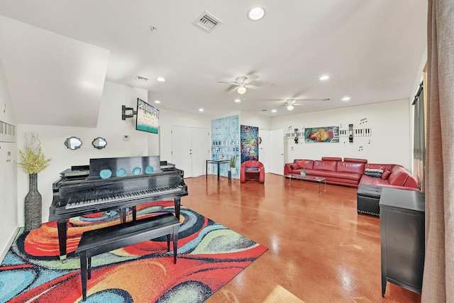 miscellaneous room with ceiling fan and concrete floors