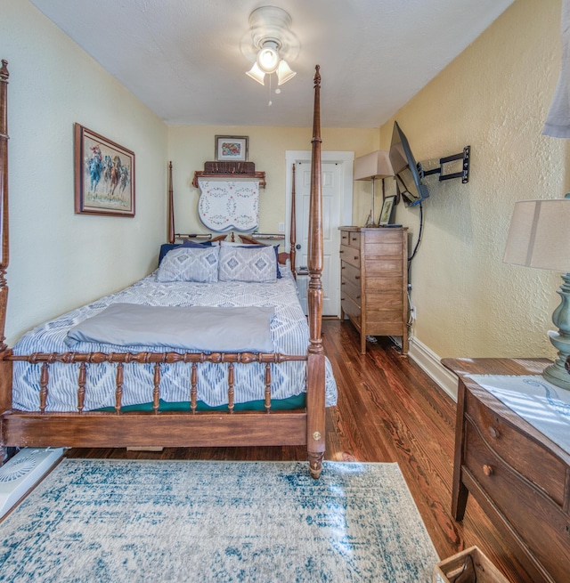 bedroom featuring dark hardwood / wood-style floors and ceiling fan